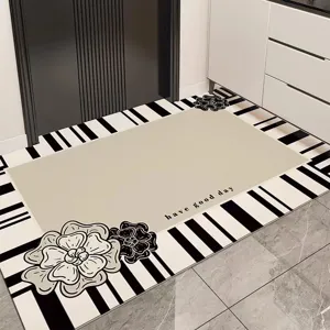 Detail shot of non-slip PVC floor mat featuring stylish black and white stripes and floral art.