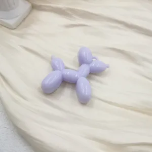 Close-up pastel purple acrylic balloon dog pendant charm for DIY crafts and phone case accessory