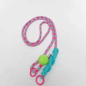Details of the colorful pink and blue braided crossbody phone lanyard with adjustable buckle.