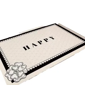 PVC entrance door mat with black and white pearl camellia design and happy text for home use.
