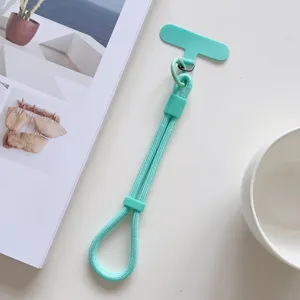 Correa de muñeca verde menta para teléfono con lengüeta, cordón corto ajustable de mano.