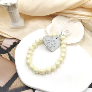 DIY beaded pearl wrist strap keychain for phone case, sweet style bag charm and mobile accessory.