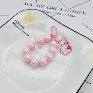 Rosa Perlen Armband Schlüsselanhänger mit süßem Kaninchen Anhänger für Handyhülle DIY Accessoire.