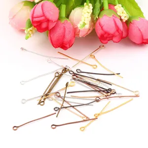 Detailed view of colorful metal eyepins for DIY jewelry making and beading crafting.