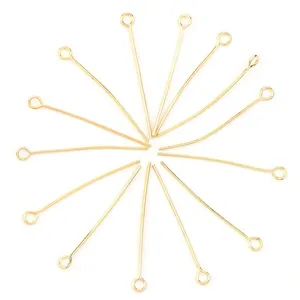 Gold eye pins for DIY jewelry making, beading findings and connectors, craft supplies detail view.