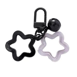 Acrylic pentagram keychain with metal clasp and bell, perfect bag charm and DIY accessory.