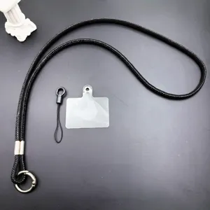 Luxury rhinestone phone lanyard with crossbody chain, short strap and clear tether tab.
