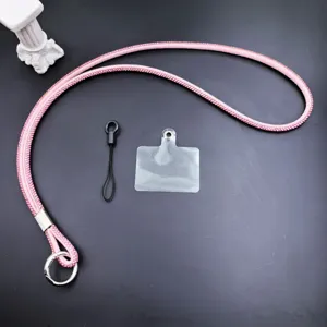 Close-up detail of luxury pink rhinestone phone lanyard strap with sparkling crystal design.