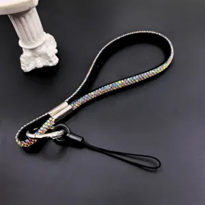 Detailed close-up shot of the sparkling rhinestone phone lanyard, showing crystal texture.