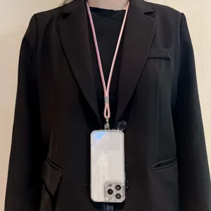 Luxury rhinestone phone lanyard with sparkling crystals for crossbody wear and anti-drop protection.