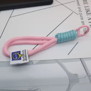 Woven nylon lanyard keychain in pink and blue with metal clasp for bags and keys detail shot