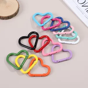 Colorful heart-shaped metal carabiners spring snap hooks for DIY keychains and bag charms.
