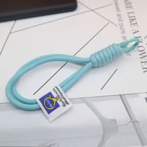 Light blue woven nylon keychain lanyard strap detail shot, perfect for bags and keys.