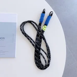 Black reflective braided phone lanyard with blue ends and cute smiley face charm for daily use.