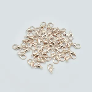 Detail view of rose gold zinc alloy lobster claw clasps for DIY jewelry making crafts.