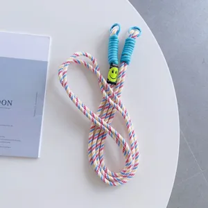 Colorful woven mobile phone lanyard with metal buckles and cute smiley face charm.