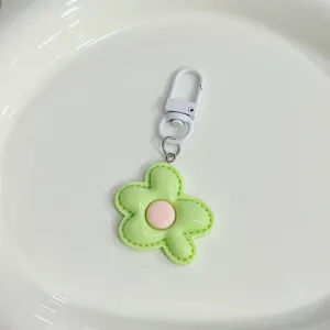 Detailed view of the cute candy color flower keychain pendant, sweet girl bag accessory.