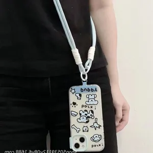 Custodia per cellulare trasparente con cordino intrecciato azzurro e simpatici cani cartoon.