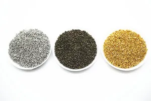 Detailed closeup of 2mm metal crimp beads in silver, bronze, and gold for DIY jewelry crafting.