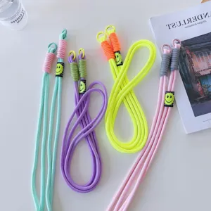 Colorful mobile phone lanyard crossbody rope with cute smiley face tags and metal buckles.
