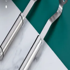 Stainless steel kitchen tool handle detail shot, smooth metallic texture and modern style close up.