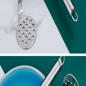 Stainless steel potato masher detail shot, food mash tool for kitchen use and baby food.