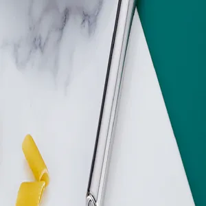 Stainless steel potato masher detail shot, durable kitchen tool for mashing baby food easily.