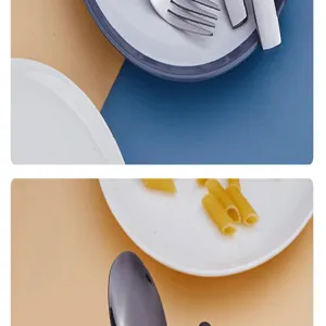 Dettaglio del set di posate in acciaio inox con forchetta, coltello, cucchiaio e piatto.