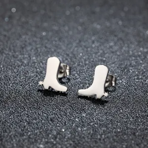 Stainless steel cowboy boot stud earring detail, mini minimalist jewelry close up.