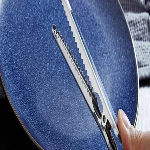 Stainless steel coffee scoop and bag sealing clip combination detail closeup view for kitchen