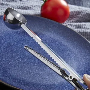 Stainless steel 2-in-1 coffee scoop and bag sealing clip for kitchen baking milk powder.
