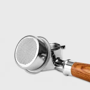 Stainless steel coffee machine portafilter with wooden handle for home espresso brewing.