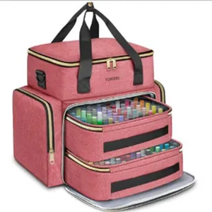 Close-up detail of the pink multi-layer storage bag with removable drawers for organizing tools.