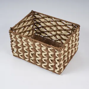 Detailed view of handmade woven storage basket, brown and beige rope desk organizer for home.
