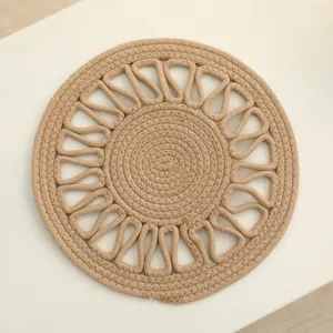 Natural handmade woven placemat round heat insulation pad for kitchen dining table use.