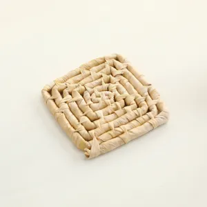 Handmade woven grass mat detail, natural plant fiber chew toy for parrots and pets.