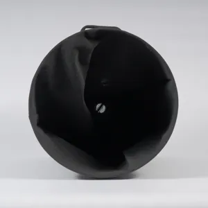 Black fabric laundry hamper detail view, collapsible storage basket interior design.