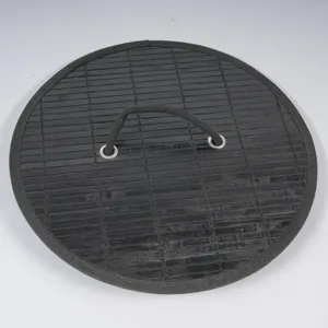 Black bamboo woven storage basket lid detail with fabric handle and metal eyelets close-up