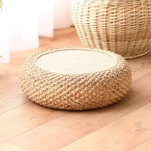 Detailed view of the natural straw woven Zen meditation cushion, thick tatami futon for home.