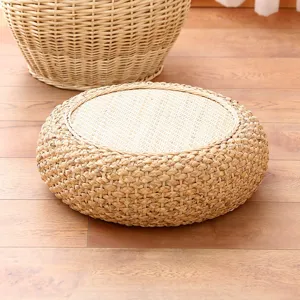 Handcrafted natural straw meditation cushion detail, Japanese tatami pouf for home.