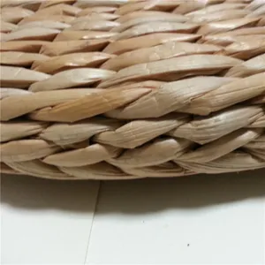 Handcrafted straw woven meditation mat detail, natural cattail yoga tatami cushion.