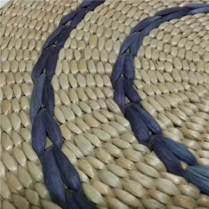 Handcrafted woven rush meditation yoga mat detail showing natural texture and purple braids.