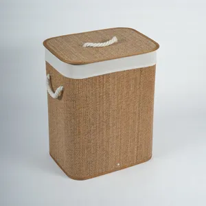 Detail view of a woven bamboo laundry hamper with lid and rope handles for home storage.