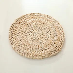 Handmade woven corn husk placemat round natural straw heat insulation table mat detail view