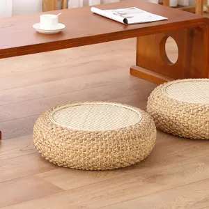Detailed view of Japanese straw woven tatami cushion, natural thick Zen meditation pouf for home tea room.