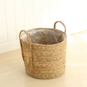Nordic straw woven flower pot basket with handles and waterproof lining for home garden decor.