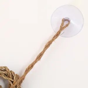 Detailed view of the pet seagrass mat hanging rope and strong suction cup attachment part.