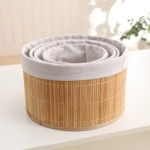 Handmade pastoral style bamboo storage basket set with fabric lining for home organization.