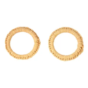 Handmade woven rattan napkin rings for elegant dining table decor and hotel western table settings.