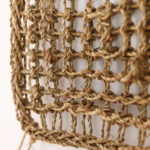 Natural seagrass woven pet climbing net detail shot, durable plant fiber lizard mat texture.